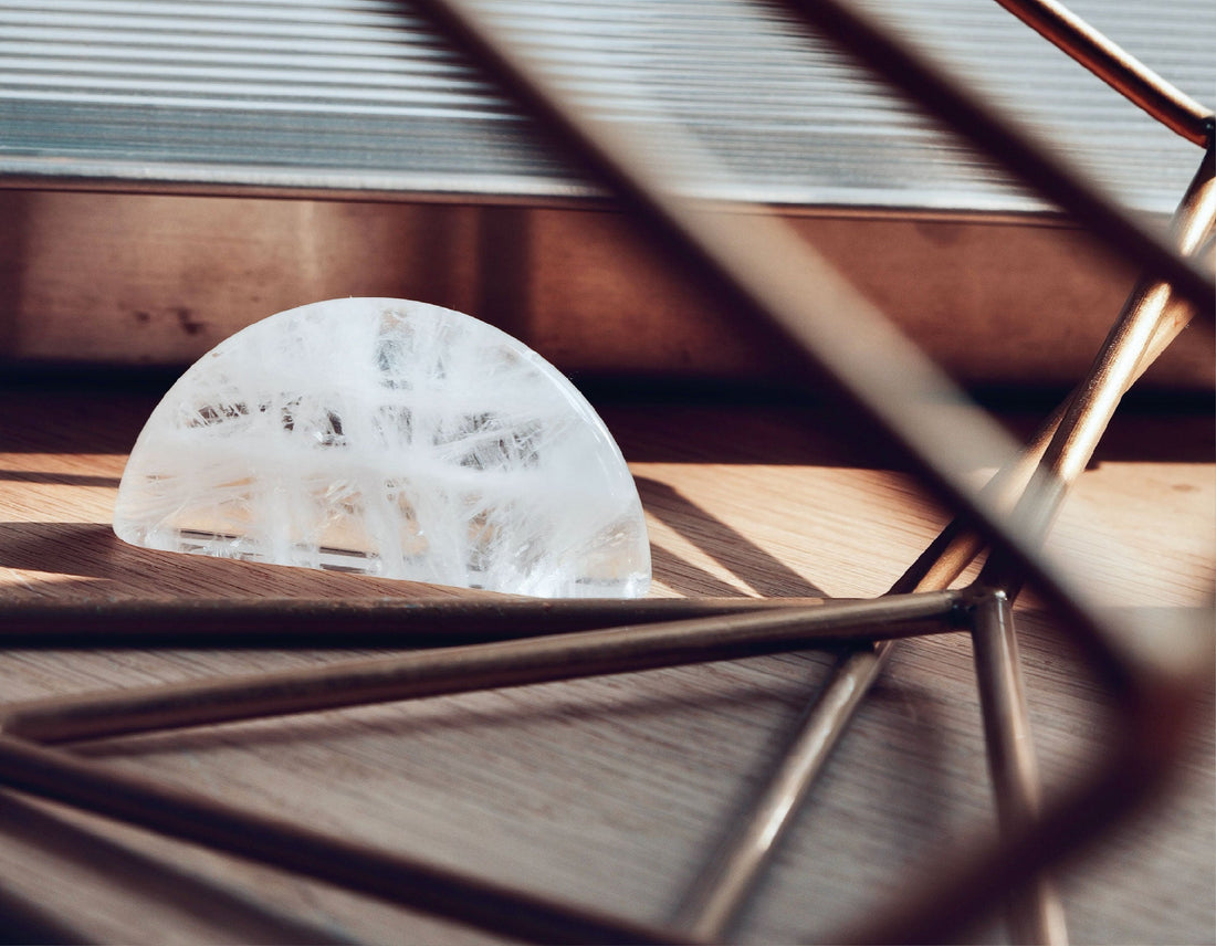 Clear Quartz healing stone resting in sunlight for clarity and energy cleansing