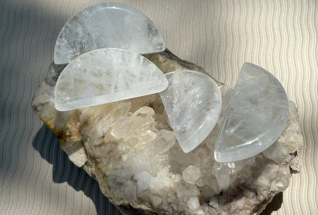 Clear quartz crystal crescents on a quartz cluster — cleansing and energy amplification