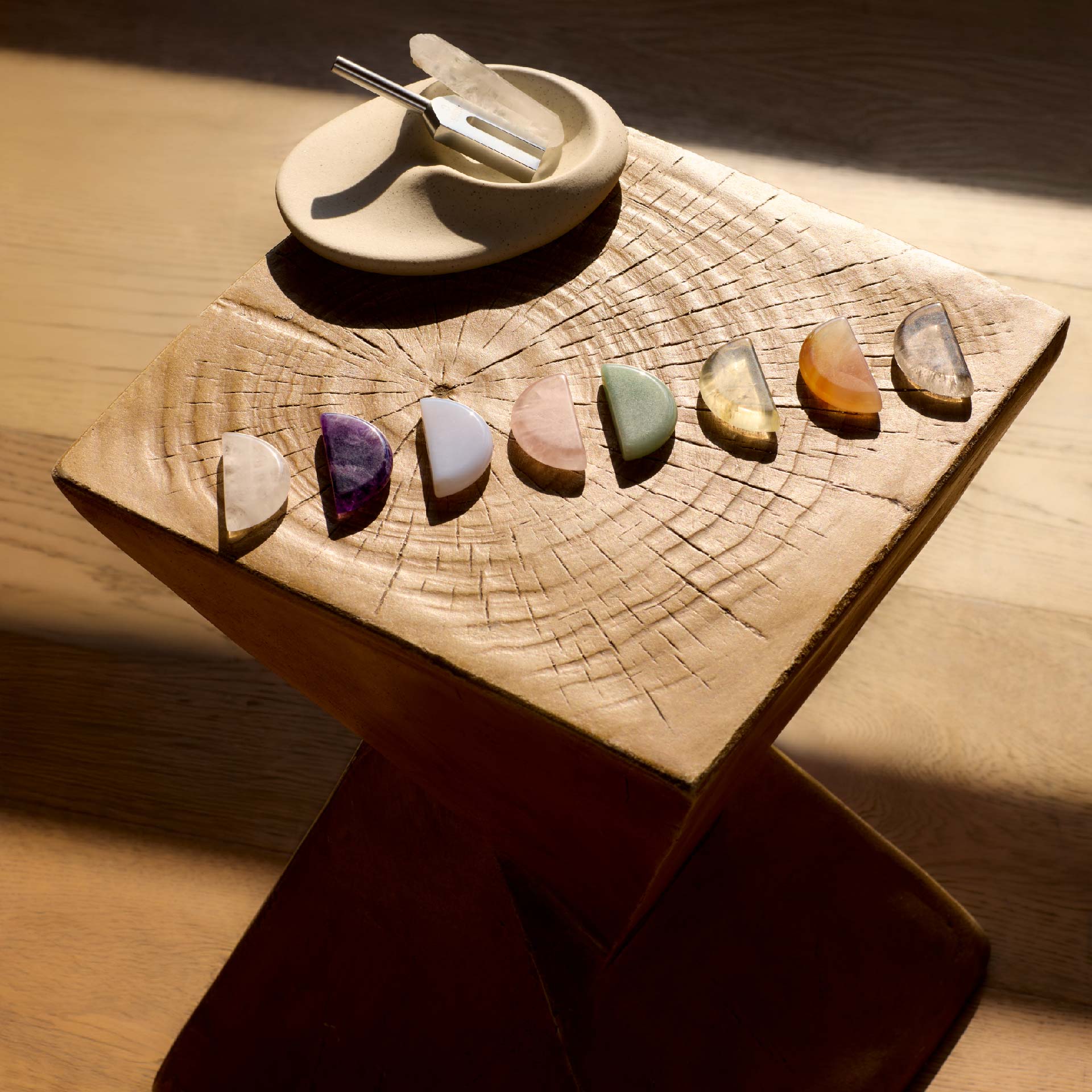 Orblink Brand Philosophy - 7 Chakra Healing Stones on Wood Symbolizing Harmony & Nature's Balance